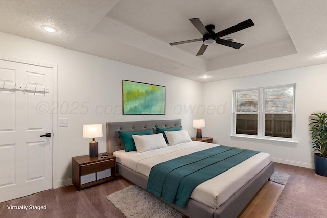 2607 15th Ave, Canyon, TX 79015 - bedroom with a raised ceiling, baseboards, ornamental molding, recessed lighting, and a ceiling fan