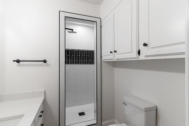 2607 15th Ave, Canyon, TX 79015 - bathroom with a shower stall, toilet, and vanity