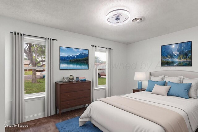 2607 15th Ave, Canyon, TX 79015 - bedroom featuring carpet, a textured ceiling, and baseboards