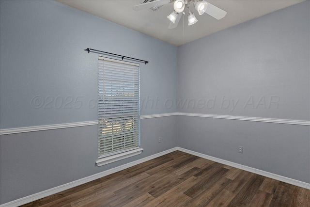 spare room featuring baseboards, a ceiling fan, and wood finished floors