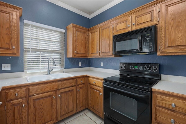 kitchen featuring brown cabinetry, black appliances, crown molding, and a sink