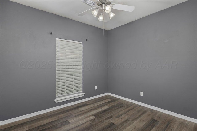 unfurnished room featuring baseboards, dark wood-type flooring, and ceiling fan