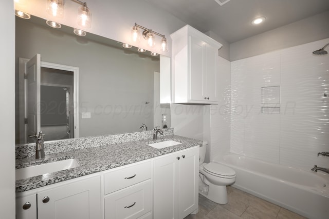 full bathroom with shower / washtub combination, vanity, tile patterned floors, and toilet