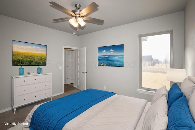 bedroom featuring dark carpet and ceiling fan