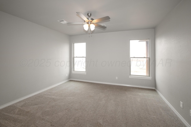 unfurnished room with ceiling fan and carpet floors