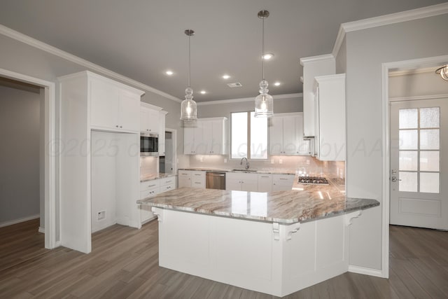 kitchen with white cabinetry, sink, kitchen peninsula, and appliances with stainless steel finishes