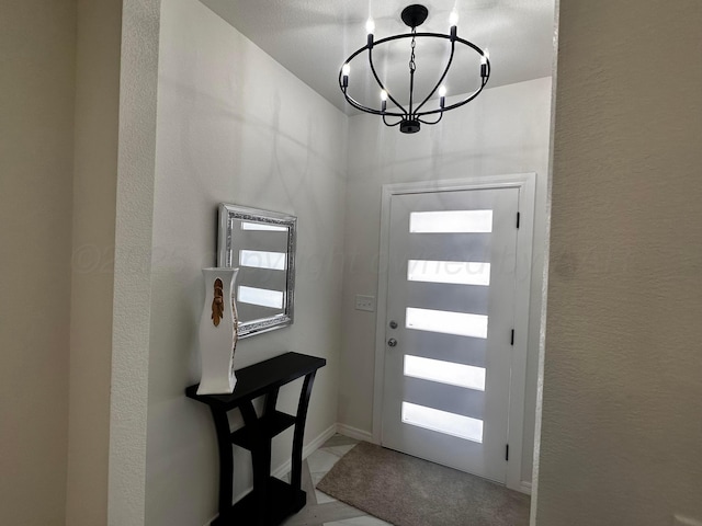 1513 SE 11th Ave, Amarillo, TX 79102 - entryway featuring a chandelier and a textured wall