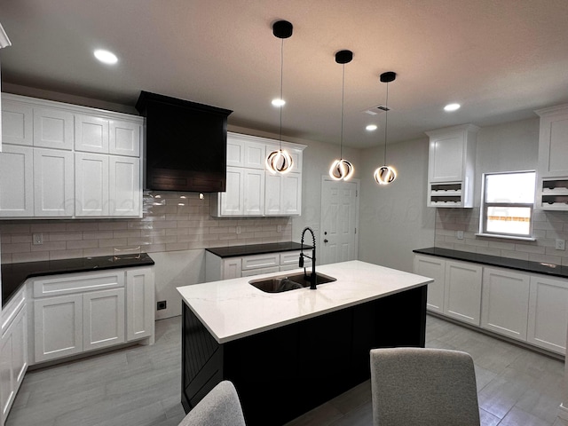 1513 SE 11th Ave, Amarillo, TX 79102 - kitchen with tasteful backsplash, pendant lighting, light wood-style floors, white cabinetry, and recessed lighting
