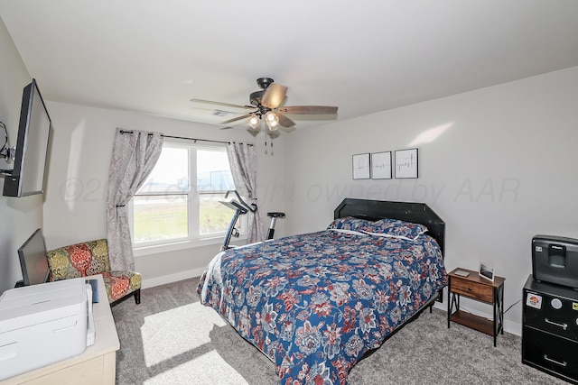 bedroom with ceiling fan and light colored carpet