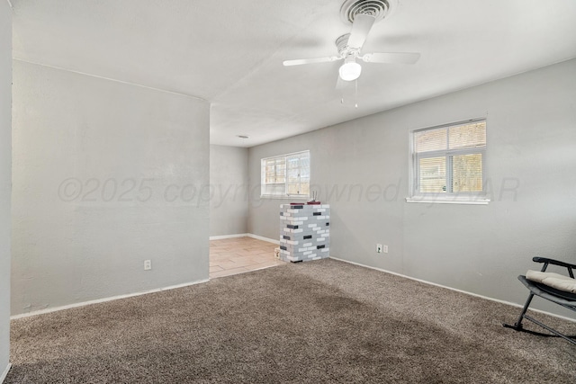 empty room with light carpet and ceiling fan