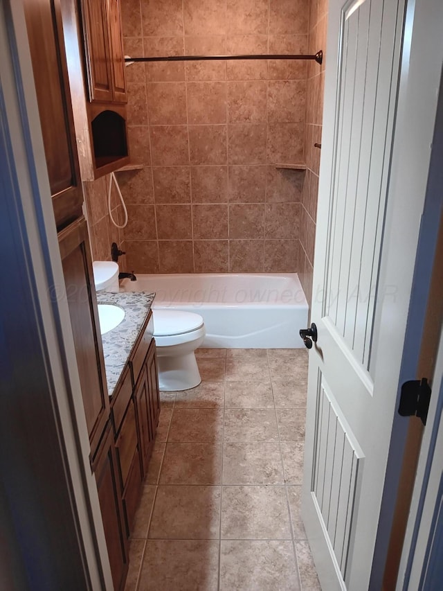 full bathroom featuring toilet, tile patterned floors, shower / bathing tub combination, and vanity