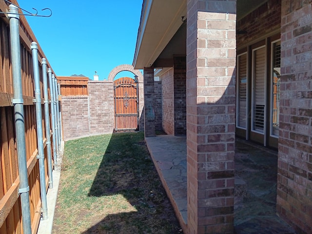 view of yard featuring a gate and fence