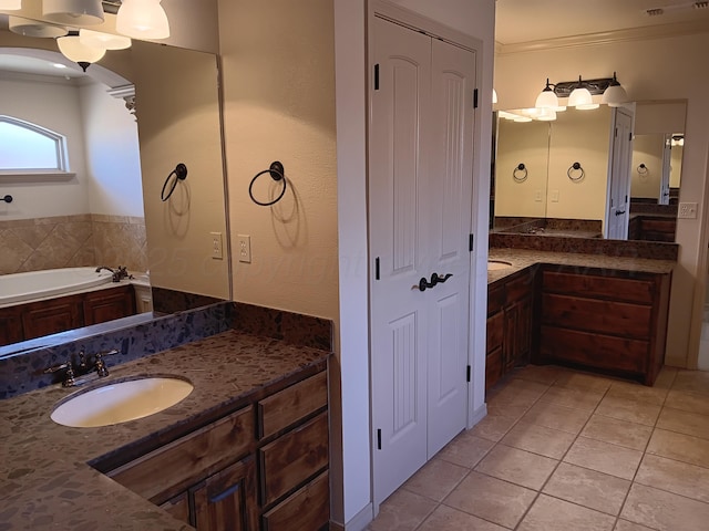 bathroom featuring ornamental molding, two vanities, tile patterned flooring, and a sink