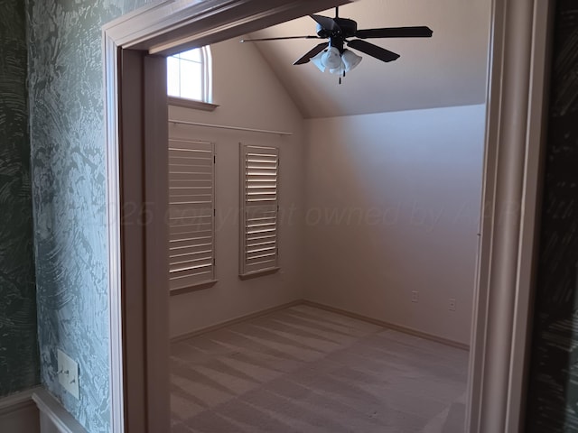 bonus room featuring vaulted ceiling, carpet floors, a ceiling fan, and baseboards