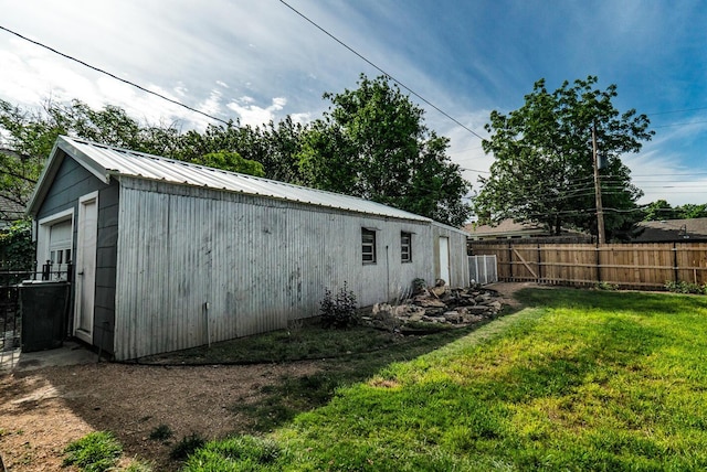 1203 Lee St, Borger, TX 79007 - view of property exterior with an outdoor structure and metal roof