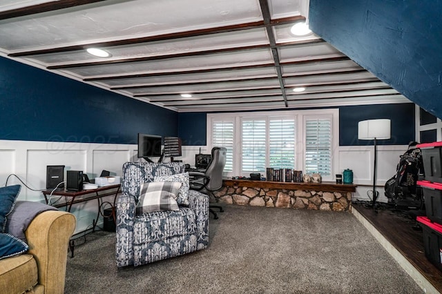 1203 Lee St, Borger, TX 79007 - living area with carpet floors, a wainscoted wall, and a decorative wall