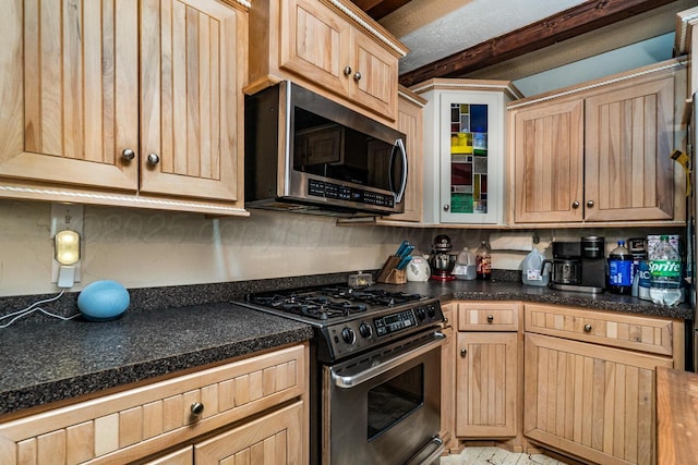 1203 Lee St, Borger, TX 79007 - kitchen featuring stainless steel appliances, dark countertops, glass insert cabinets, decorative backsplash, and light brown cabinetry