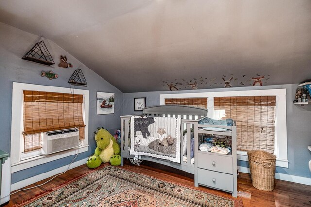 1203 Lee St, Borger, TX 79007 - bedroom featuring vaulted ceiling, cooling unit, wood finished floors, and baseboards