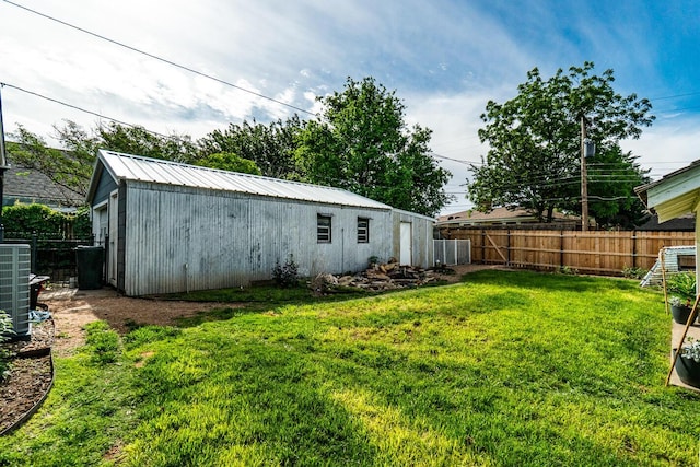 1203 Lee St, Borger, TX 79007 - view of yard with central AC and an outbuilding