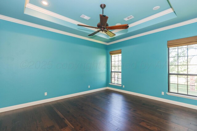 3 Country Club Dr, Amarillo, TX 79124 - unfurnished room with a tray ceiling, ceiling fan, dark wood-style flooring, and ornamental molding