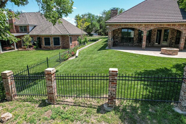 3 Country Club Dr, Amarillo, TX 79124 - fenced backyard with a patio and a fire pit