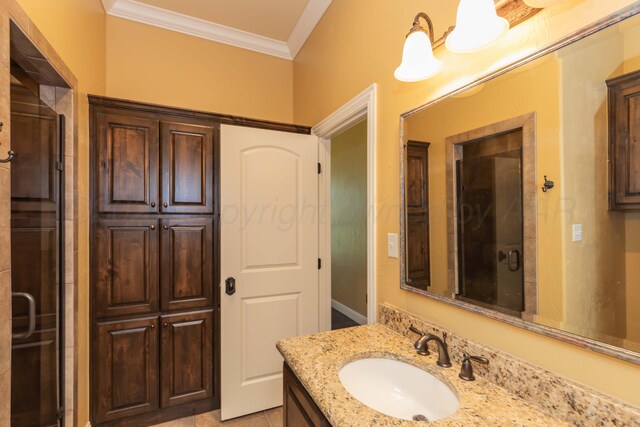 3 Country Club Dr, Amarillo, TX 79124 - bathroom with crown molding, vanity, and a shower with door