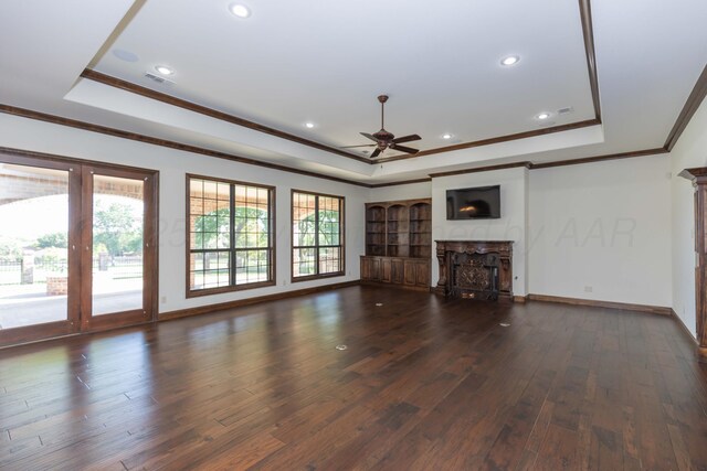 3 Country Club Dr, Amarillo, TX 79124 - unfurnished living room with a tray ceiling, ceiling fan, a fireplace, ornamental molding, and dark wood finished floors