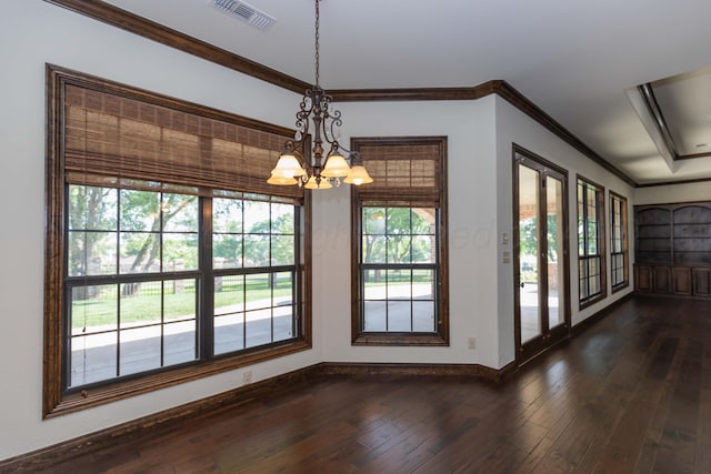 3 Country Club Dr, Amarillo, TX 79124 - unfurnished dining area featuring plenty of natural light, a chandelier, dark wood-type flooring, and ornamental molding