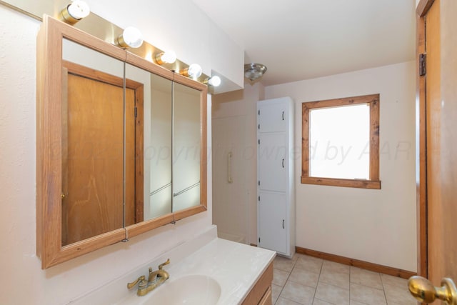 925 W Colorado Ave, Amarillo, TX 79108 - bathroom with vanity, tile patterned flooring, and baseboards