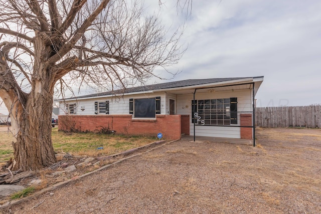 925 W Colorado Ave, Amarillo, TX 79108 - view of front facade featuring brick siding and roof with shingles