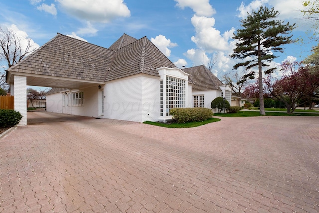 view of side of property featuring a carport