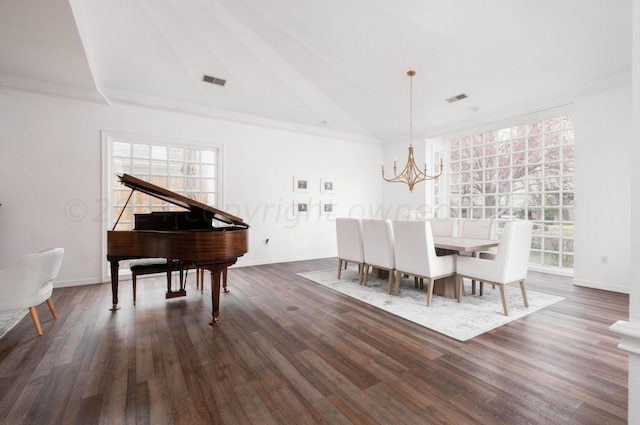 dining space with dark wood-type flooring, a chandelier, high vaulted ceiling, and ornamental molding