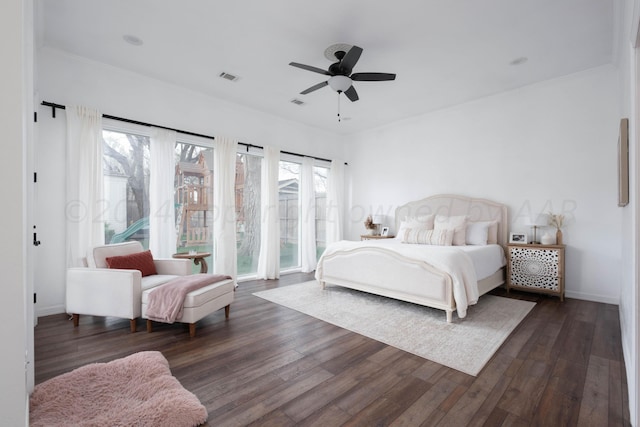 bedroom featuring dark wood-type flooring and ceiling fan