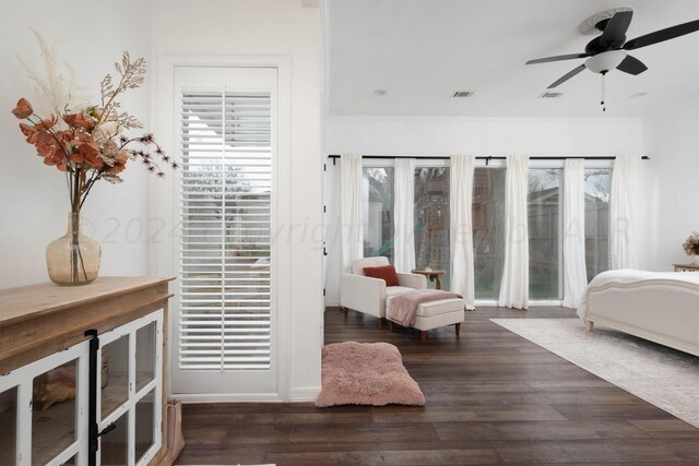 bedroom with dark wood-type flooring and ceiling fan