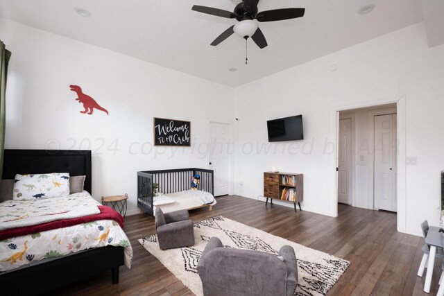 bedroom with ceiling fan and dark hardwood / wood-style floors