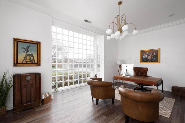 interior space with a notable chandelier, dark hardwood / wood-style flooring, and ornamental molding