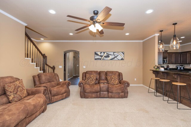 7116 Bennett St, Amarillo, TX 79119 - living room featuring crown molding, recessed lighting, arched walkways, light carpet, and a ceiling fan