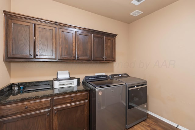 7116 Bennett St, Amarillo, TX 79119 - clothes washing area with independent washer and dryer, cabinet space, baseboards, and dark wood finished floors