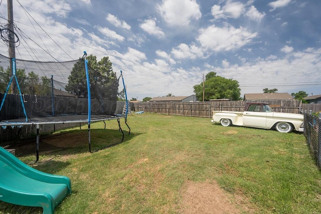 4215 S Tyler St, Amarillo, TX 79110 - fenced backyard with a trampoline and a playground