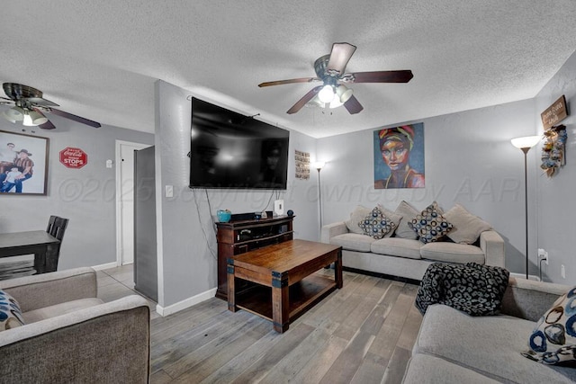 4215 S Tyler St, Amarillo, TX 79110 - living area with a ceiling fan, a textured ceiling, and light wood finished floors