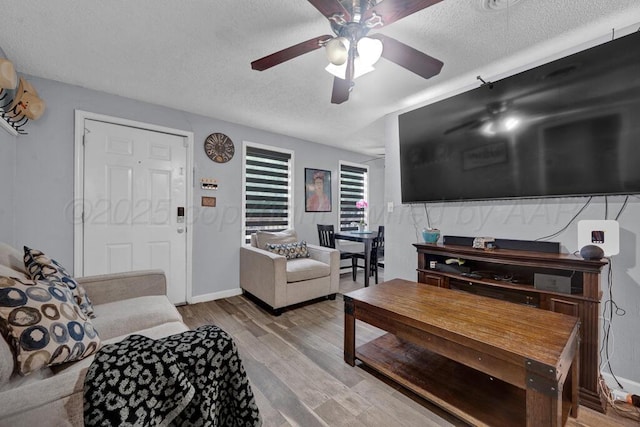 4215 S Tyler St, Amarillo, TX 79110 - living area featuring a textured ceiling, light wood-type flooring, and ceiling fan