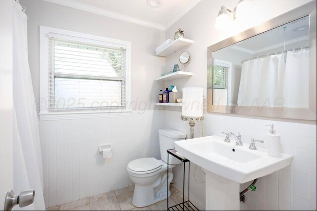 2406 Anna St, Amarillo, TX 79106 - full bath with toilet, tile walls, ornamental molding, a shower with shower curtain, and tile patterned flooring