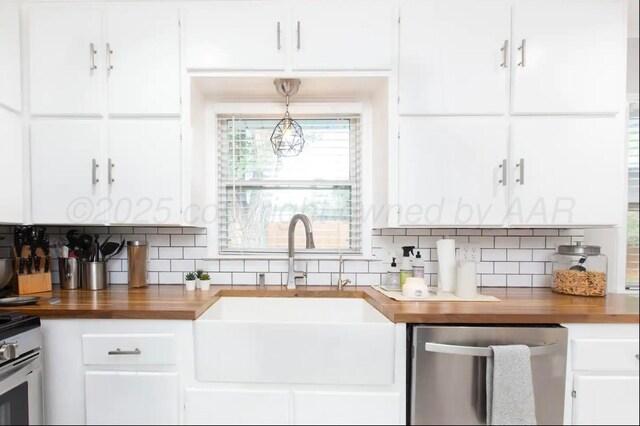 2406 Anna St, Amarillo, TX 79106 - kitchen with wooden counters, a sink, stainless steel dishwasher, white cabinets, and tasteful backsplash
