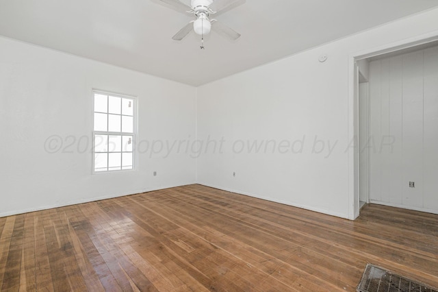 unfurnished room featuring a ceiling fan and hardwood / wood-style floors