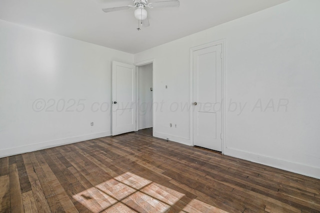 unfurnished bedroom featuring a ceiling fan, baseboards, and dark wood-type flooring