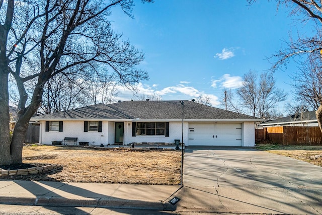 ranch-style home featuring a garage