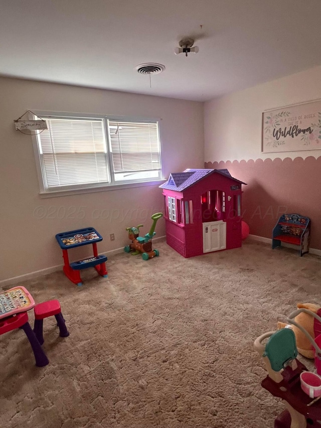 game room with carpet, visible vents, and baseboards