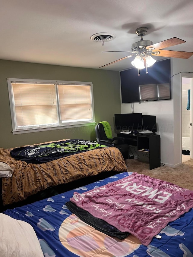 carpeted bedroom featuring visible vents and ceiling fan