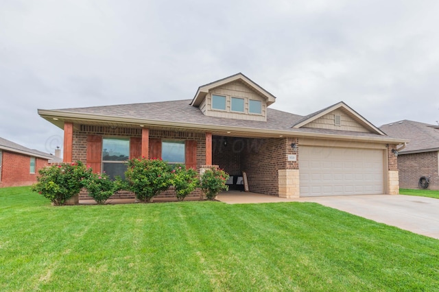 9310 Rockwood Dr, Amarillo, TX 79119 - view of front of house with a shingled roof, a front lawn, brick siding, a garage, and driveway