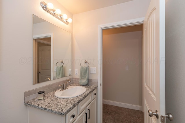 9310 Rockwood Dr, Amarillo, TX 79119 - bathroom with baseboards and vanity